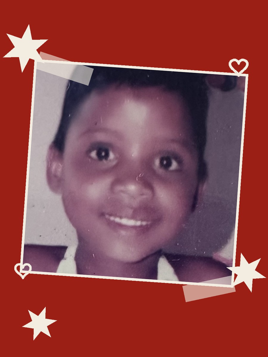 Scrapbook-style childhood photo of Asande taped onto a red background with paper-colored star and heart doodles